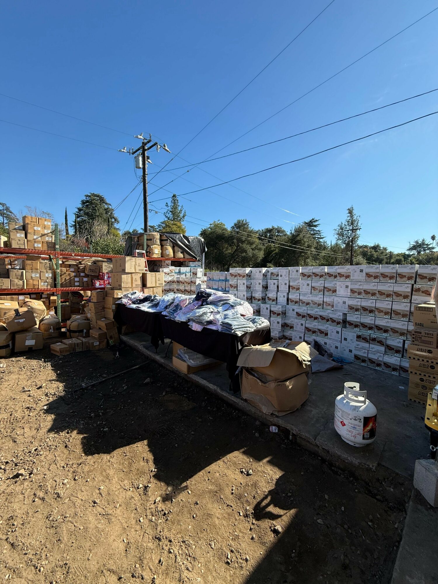 FRF outdoor supply depot with pallets of aid stacked high
