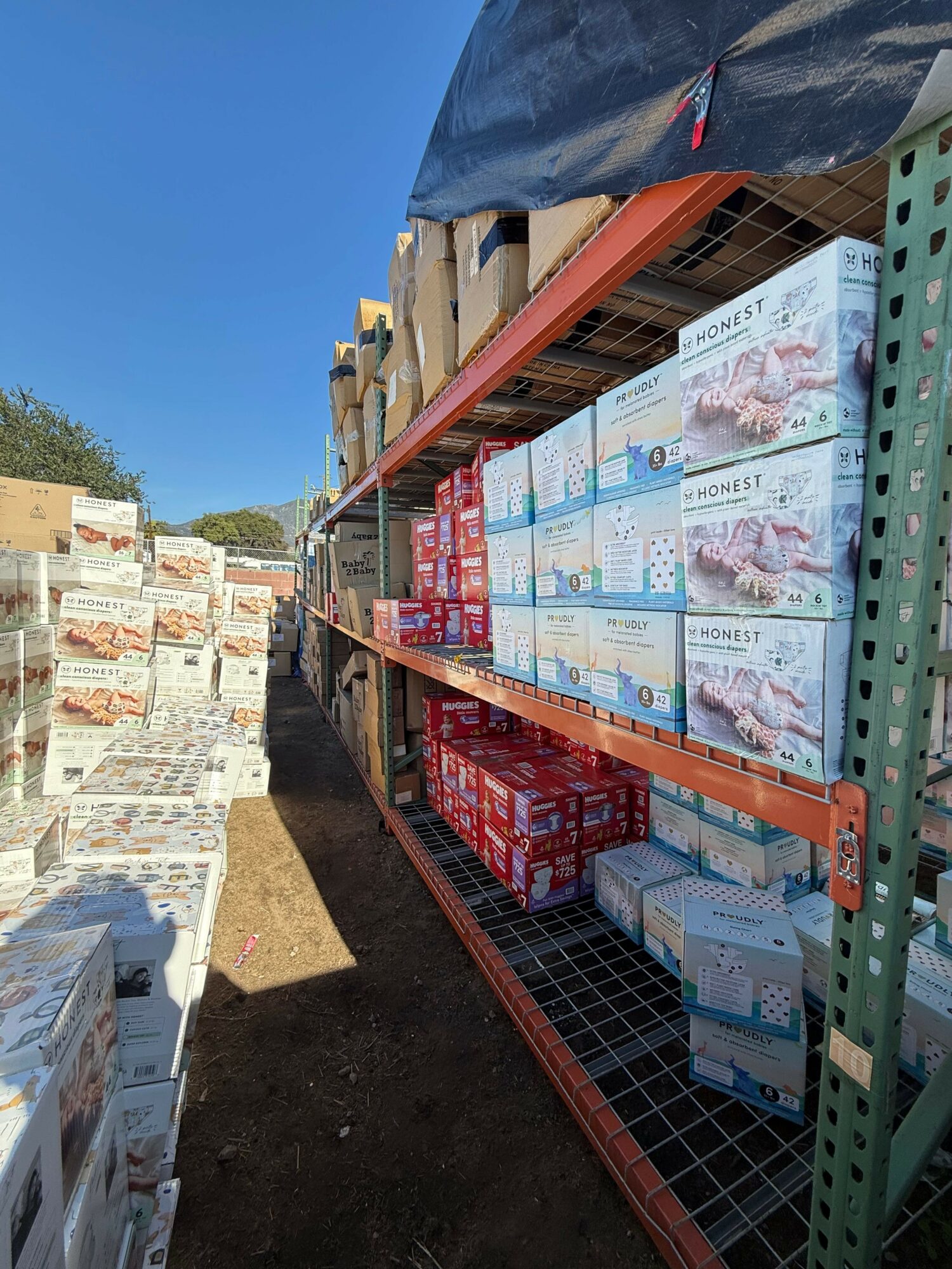 Industrial shelving stocked with diapers and baby supplies